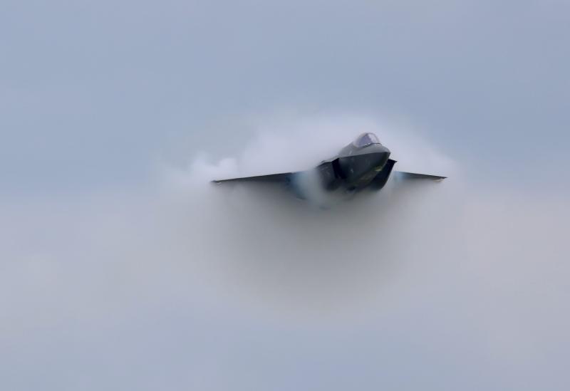 The F-35A creates a shockwave and vapor cone on a high-speed pass in front of the crowd. The F-35 demo team is based at Hill AFB in Utah.